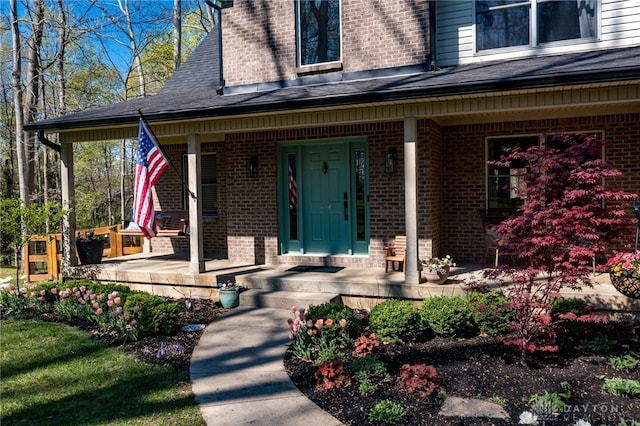 9171 Big Oak Dr, Washington Twp, OH 45458 - property entrance with a porch, brick siding, and a shingled roof