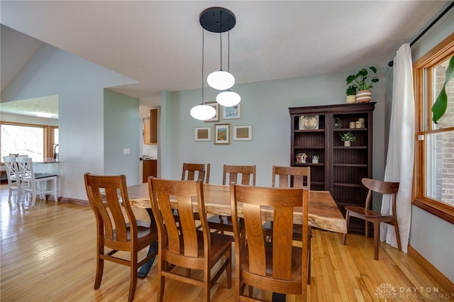 9171 Big Oak Dr, Washington Twp, OH 45458 - dining area featuring light wood-type flooring, healthy amount of natural light, and baseboards