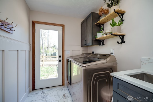 9171 Big Oak Dr, Washington Twp, OH 45458 - clothes washing area featuring cabinet space, washer and clothes dryer, and plenty of natural light