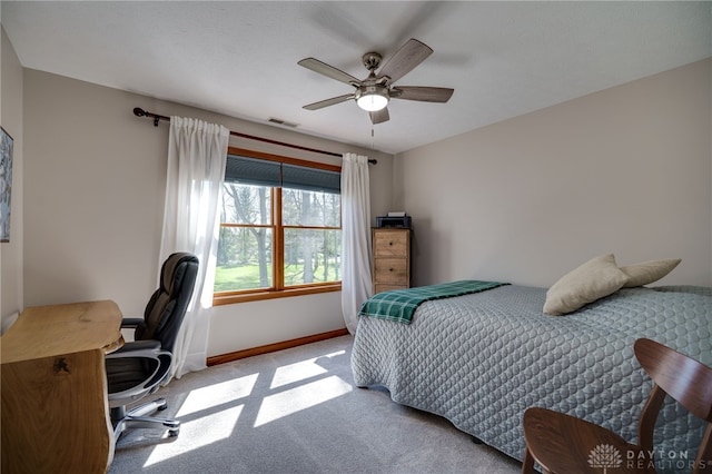 9171 Big Oak Dr, Washington Twp, OH 45458 - carpeted bedroom with baseboards, an office area, and a ceiling fan