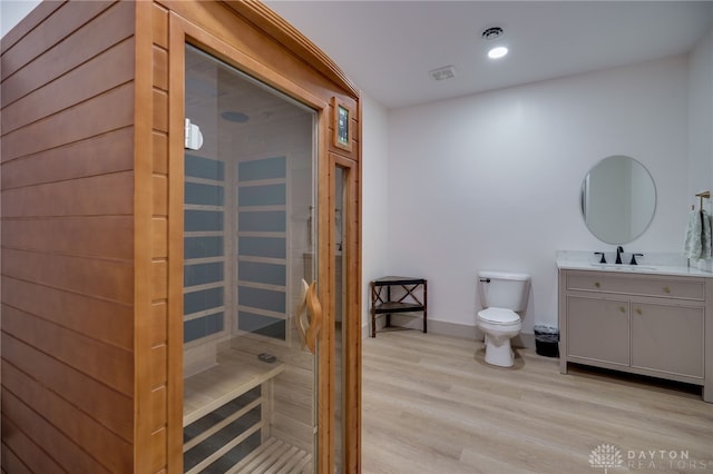 9171 Big Oak Dr, Washington Twp, OH 45458 - bathroom with a sauna / steam room, toilet, wood finished floors, vanity, and baseboards