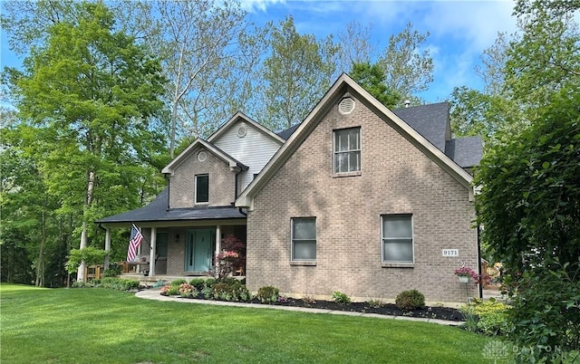 9171 Big Oak Dr, Washington Twp, OH 45458 - view of front of house with a front lawn, a porch, and brick siding