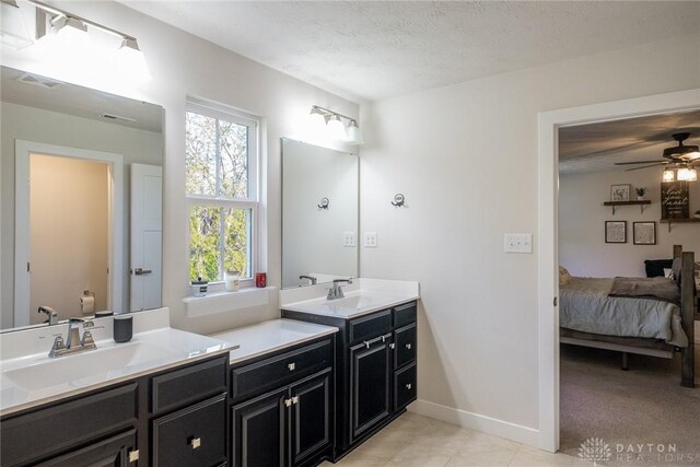 full bath with a ceiling fan, tile patterned floors, baseboards, toilet, and visible vents