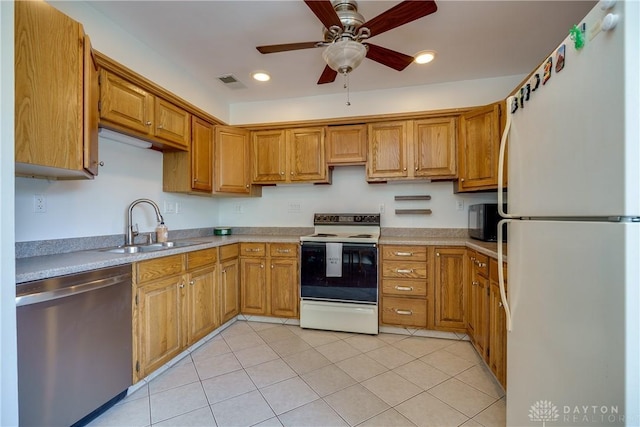 kitchen featuring a sink, white appliances, ceiling fan, light countertops, and visible vents