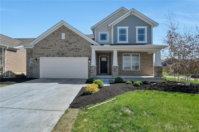 craftsman-style home featuring covered porch, brick siding, a front lawn, concrete driveway, and an attached garage
