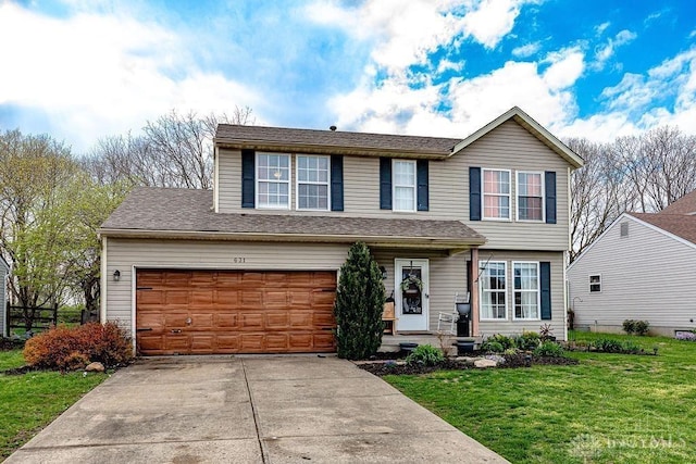 631 Alpine Pl, Trenton, OH 45067 - view of front of property featuring a garage, driveway, and a front lawn