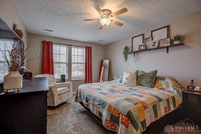 631 Alpine Pl, Trenton, OH 45067 - carpeted bedroom featuring visible vents, a textured ceiling, and ceiling fan