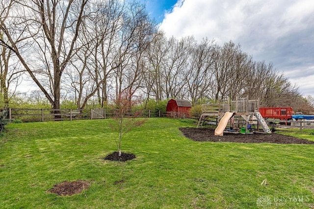 631 Alpine Pl, Trenton, OH 45067 - view of yard featuring fence, an outdoor structure, and a playground