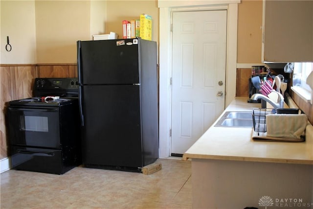 kitchen with black appliances, brown cabinets, and light countertops