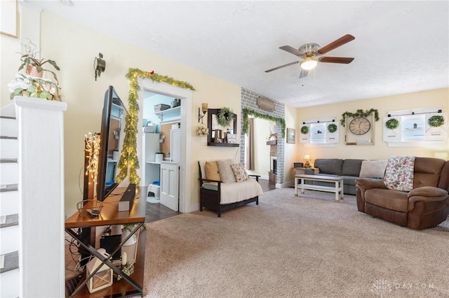 carpeted living room with ceiling fan