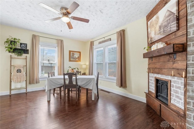 714 E Pearl St, Miamisburg, OH 45342 - dining space with baseboards, visible vents, a textured ceiling, and wood finished floors