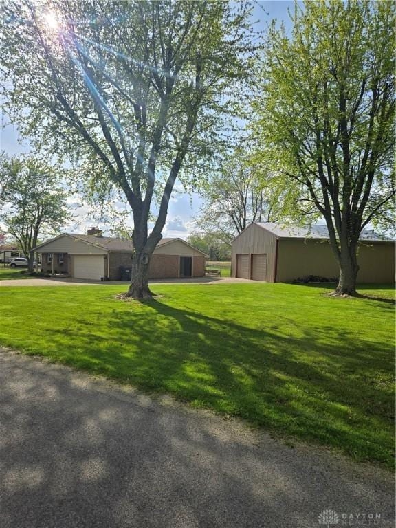 exterior space featuring a front yard and a garage