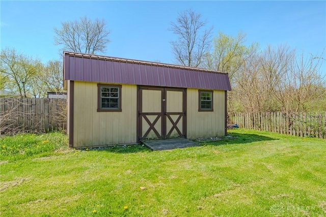 view of shed with fence