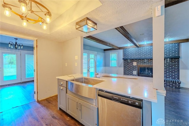 kitchen featuring a sink, open floor plan, dishwasher, dark wood finished floors, and french doors