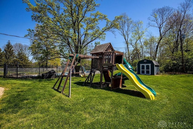 view of play area featuring fence and a lawn