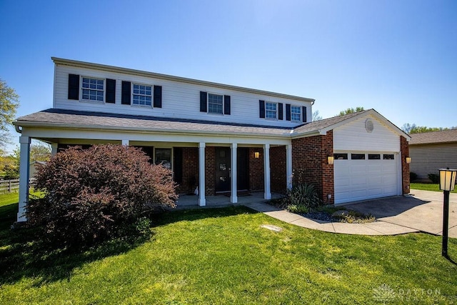 traditional home featuring covered porch, a front yard, driveway, and an attached garage