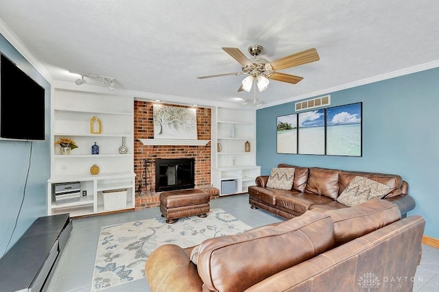 tiled living room featuring a textured ceiling, visible vents, a fireplace, a ceiling fan, and built in features
