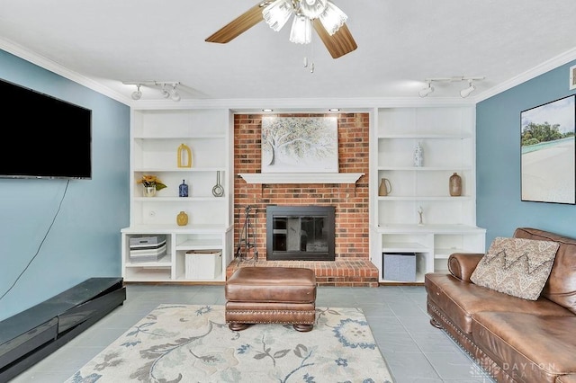 living area featuring track lighting, tile patterned floors, built in features, and crown molding
