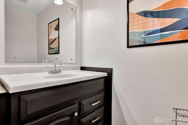 bathroom with visible vents and vanity