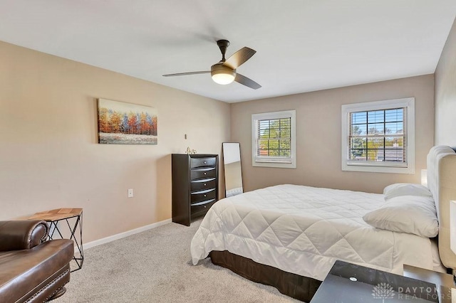 carpeted bedroom with baseboards and ceiling fan