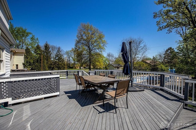 deck featuring outdoor dining area