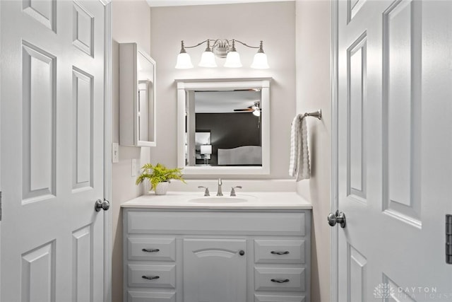 bathroom with ceiling fan and vanity