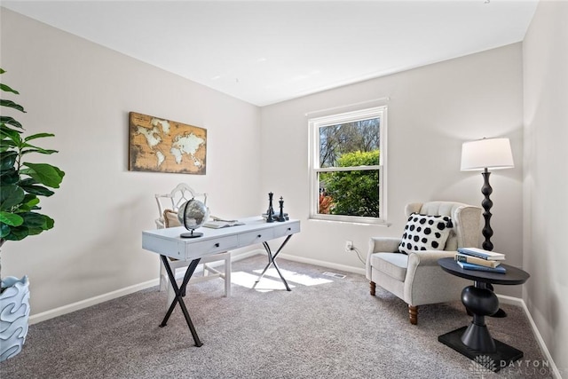 carpeted office featuring visible vents and baseboards