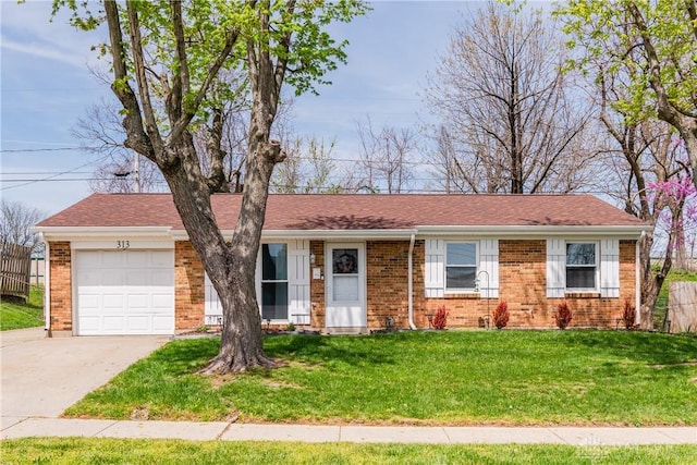 single story home with brick siding, fence, a front lawn, concrete driveway, and an attached garage