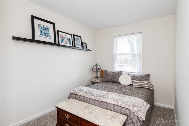 carpeted bedroom with baseboards