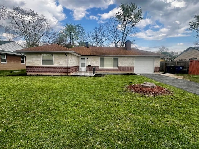 ranch-style house featuring aphalt driveway, a front yard, fence, brick siding, and a garage