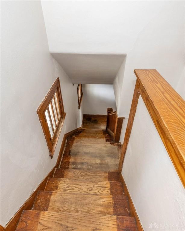 staircase featuring hardwood / wood-style flooring