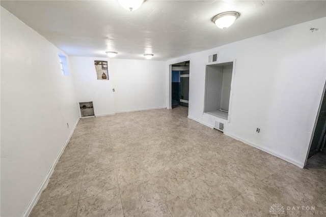 interior space with visible vents and baseboards