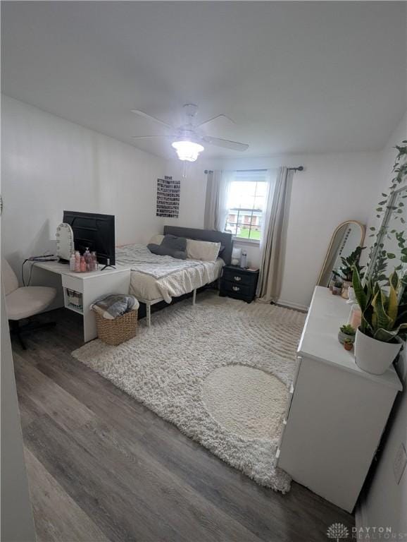 bedroom with ceiling fan and wood finished floors