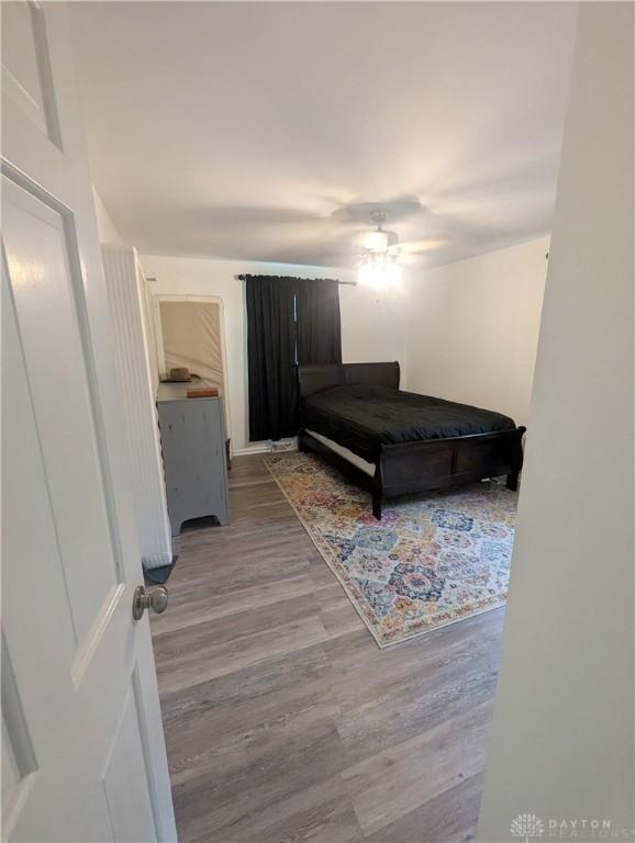 bedroom with wood finished floors and ceiling fan