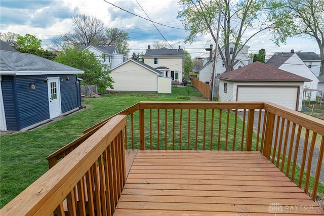 9 Wiltshire Blvd, Oakwood, OH 45419 - deck featuring an outdoor structure, a fenced backyard, a yard, a garage, and a residential view