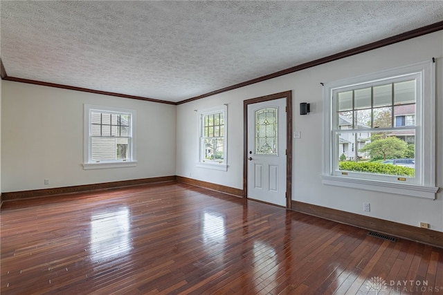 9 Wiltshire Blvd, Oakwood, OH 45419 - entryway featuring wood-type flooring, baseboards, visible vents, a textured ceiling, and crown molding