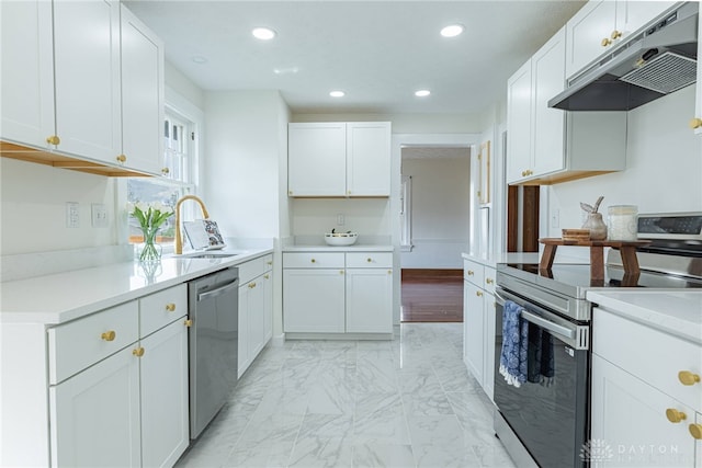 9 Wiltshire Blvd, Oakwood, OH 45419 - kitchen with recessed lighting, stainless steel appliances, under cabinet range hood, light countertops, and a sink