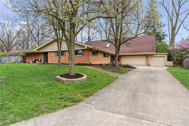 5262 Bittersweet Dr, Washington Twp, OH 45429 - single story home featuring a front lawn, a garage, brick siding, concrete driveway, and fence