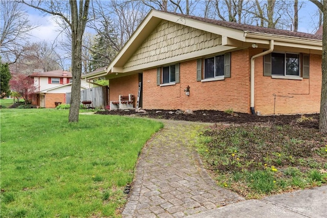 5262 Bittersweet Dr, Washington Twp, OH 45429 - view of front of house with a front yard and brick siding