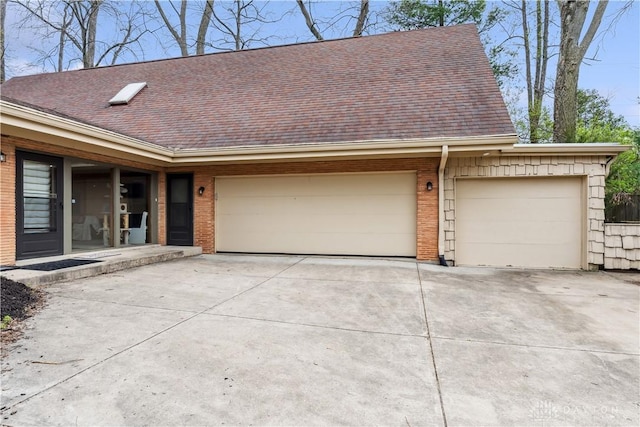 5262 Bittersweet Dr, Washington Twp, OH 45429 - view of front of home featuring concrete driveway, a garage, a shingled roof, and brick siding