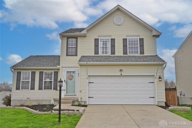 171 Pleasant Hill Blvd, Franklin, OH 45005 - traditional-style house with a front yard, roof with shingles, a garage, fence, and concrete driveway