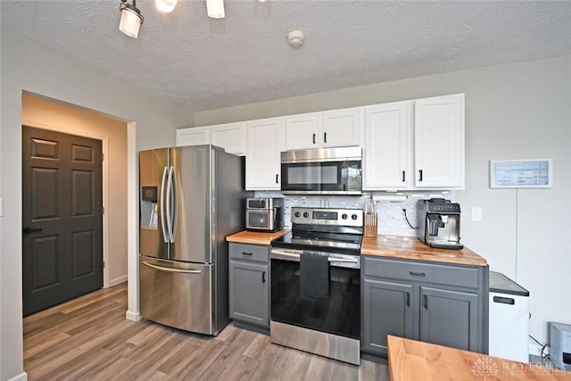 171 Pleasant Hill Blvd, Franklin, OH 45005 - kitchen with gray cabinetry, appliances with stainless steel finishes, light wood-style floors, and butcher block counters
