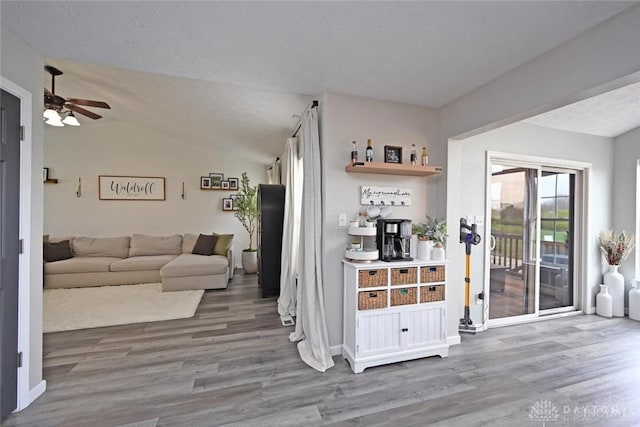 171 Pleasant Hill Blvd, Franklin, OH 45005 - living room featuring a ceiling fan, baseboards, vaulted ceiling, and wood finished floors