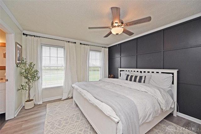 171 Pleasant Hill Blvd, Franklin, OH 45005 - bedroom with crown molding, ceiling fan, light wood finished floors, a decorative wall, and baseboards