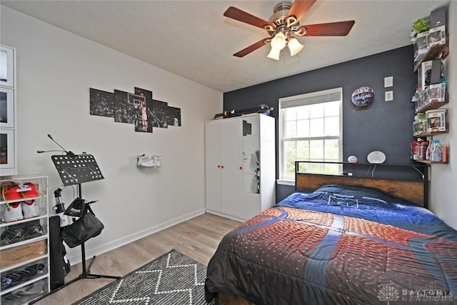 171 Pleasant Hill Blvd, Franklin, OH 45005 - bedroom with baseboards, ceiling fan, and wood finished floors