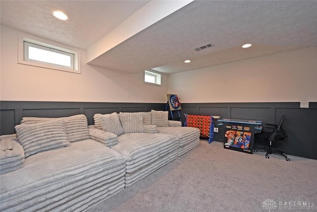 171 Pleasant Hill Blvd, Franklin, OH 45005 - carpeted living room with visible vents, recessed lighting, a decorative wall, and a wainscoted wall