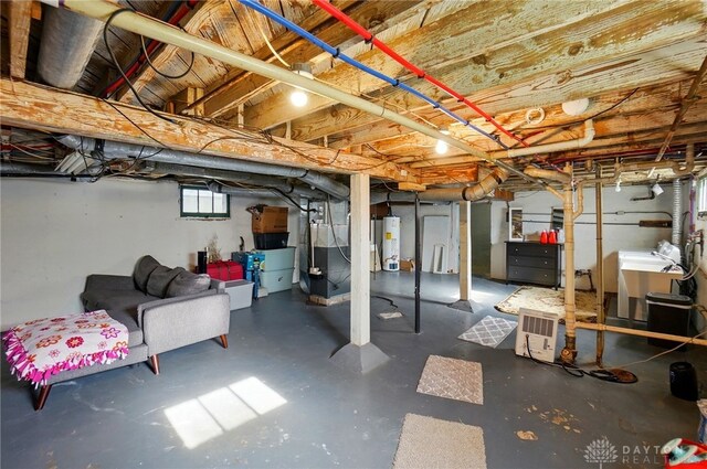 1708 Patterson Rd, Dayton, OH 45420 - basement with water heater, heating unit, and washer / clothes dryer