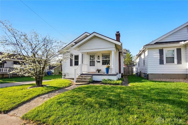 1708 Patterson Rd, Dayton, OH 45420 - view of front of home with a chimney and a front yard