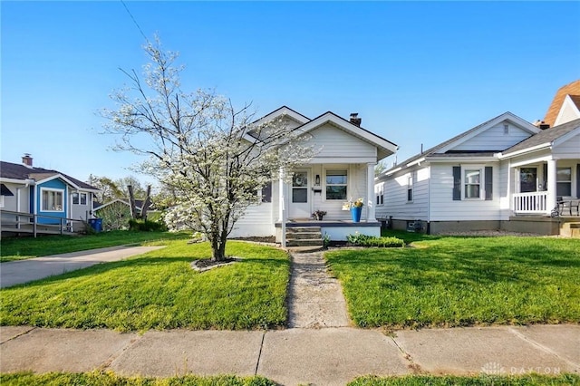 1708 Patterson Rd, Dayton, OH 45420 - shotgun-style home featuring covered porch and a front yard