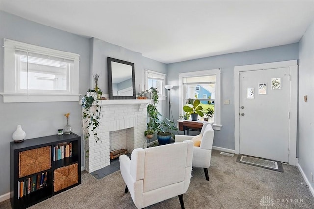 1708 Patterson Rd, Dayton, OH 45420 - carpeted entryway with a brick fireplace and baseboards